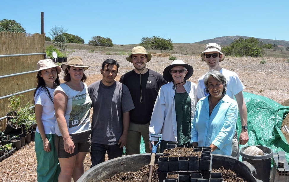 Adrian Lievano (center) in the field.