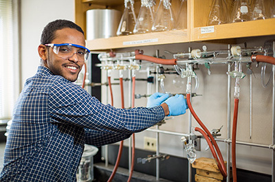 Ahmed Elnaiem at work in the lab as a Posse Scholar at Bucknell.