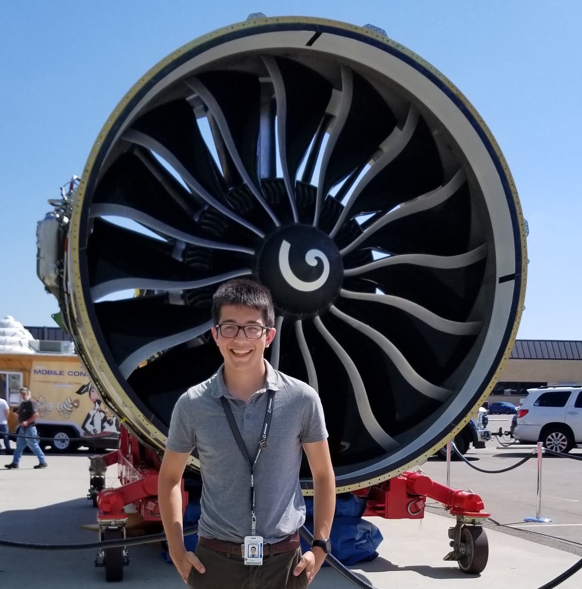 University of Michigan Posse Scholar Leandro Martinez with a GE9X engine during his internship at GE.