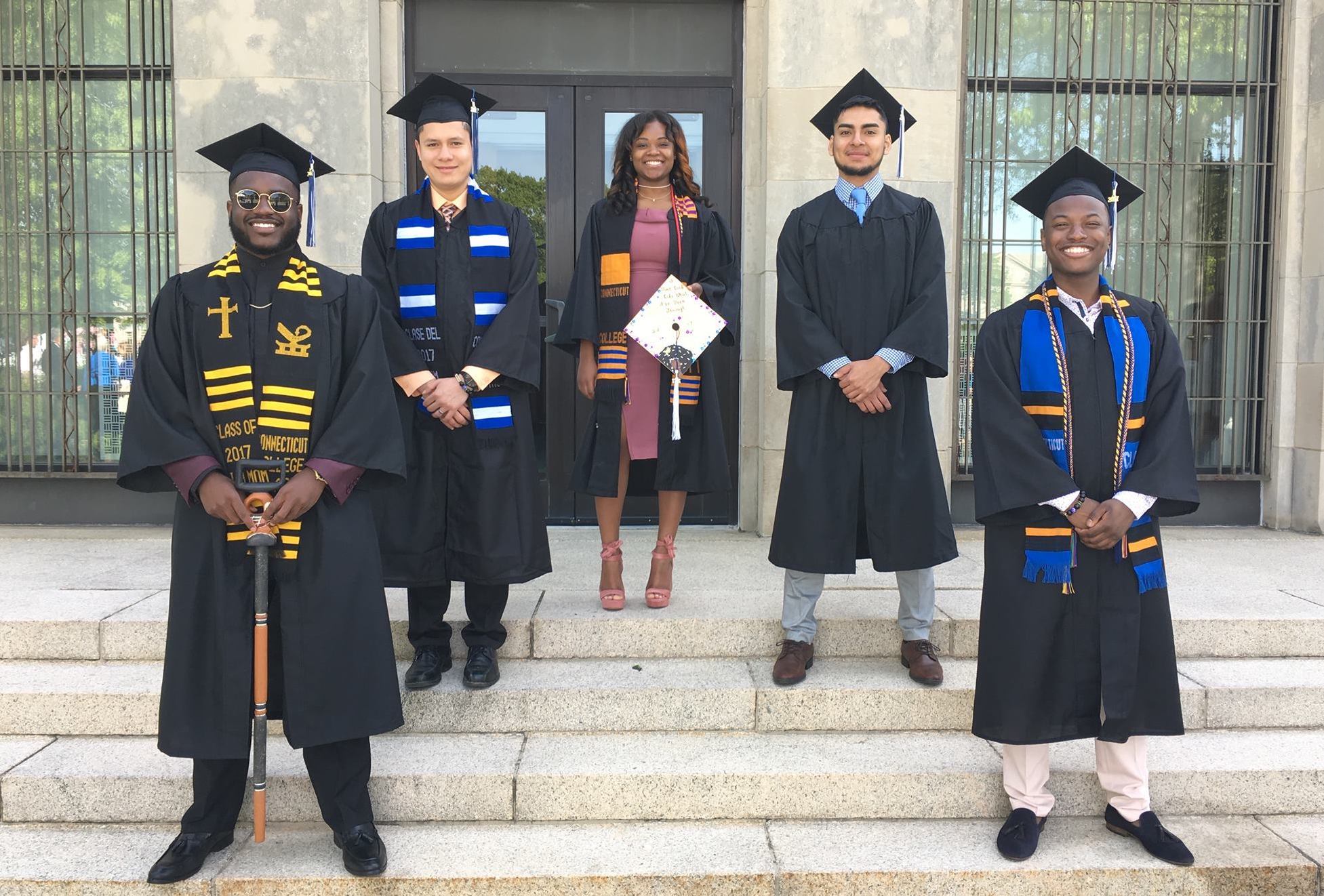 Maurice (left) with fellow Posse Scholars at his Connecticut College graduation in 2017.
