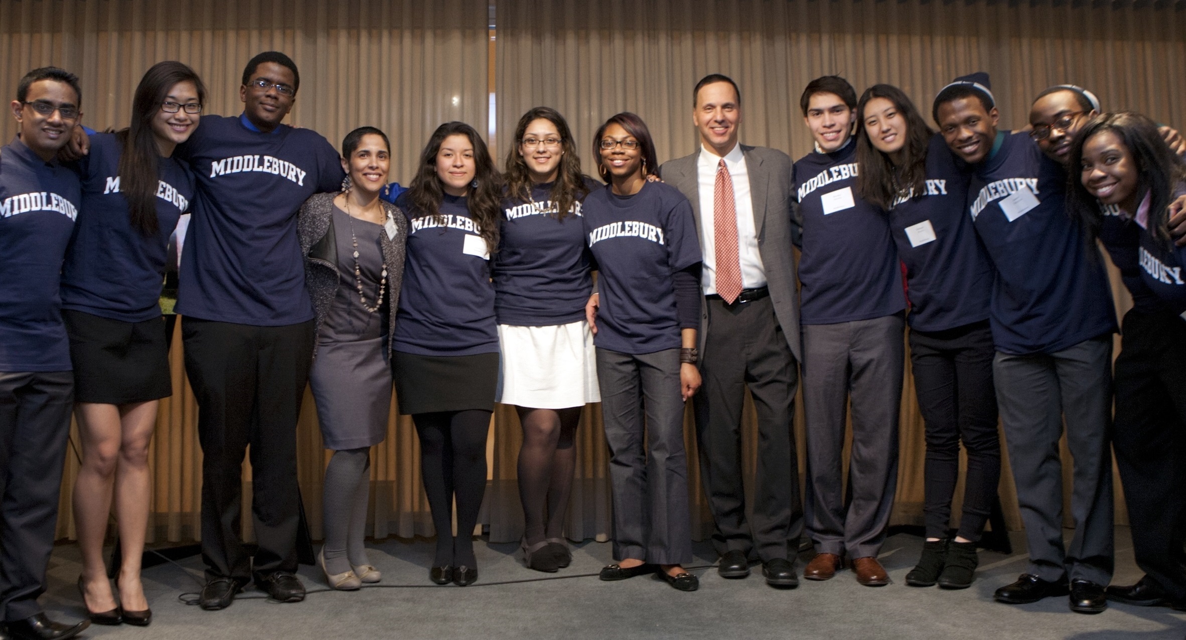 Shirley Collado with a group of Middlebury Posse Scholars and then-President Ron Liebowitz in 2012.