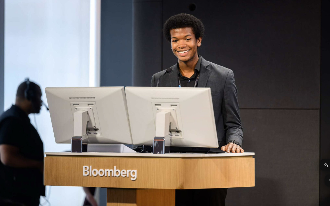 Scholar at a podium.