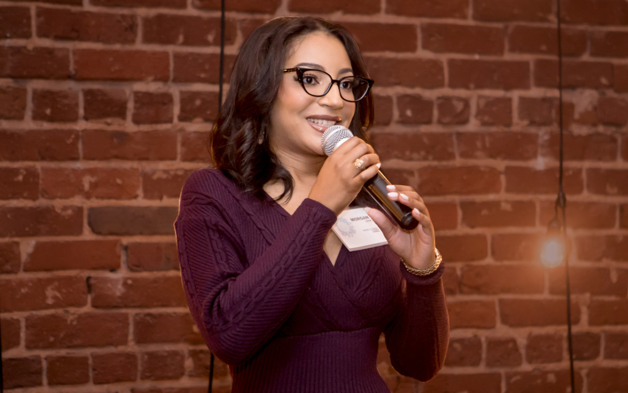 Woman Speaking into microphone