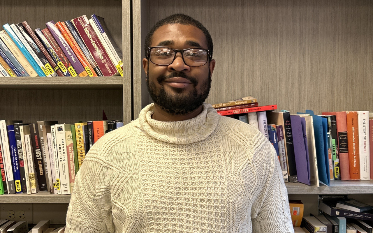 Man smiling in library