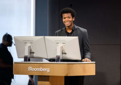 Scholar at a podium.