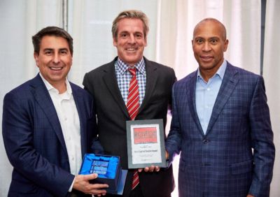 Bain Capital Double Impact Managing Directors Todd Cook, Warren Valdmanis and Governor Deval Patrick.
