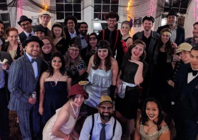 Posse alumni and friends at Posse Chicago's murder-mystery fundraising party last year.