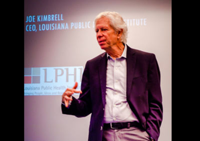 Joe Kimbrell, the CEO of Louisiana Public Health Institute, addresses New Orleans Scholars, alumni, and supporters at the Internship Celebration.