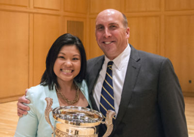 Sandy Tran with the DePauw University Walker Cup and DePauw President Brian W. Casey.