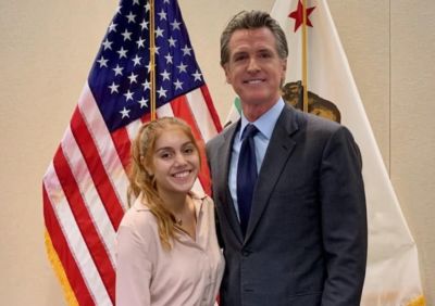 Left to right: 2021 Jeff Ubben Posse Fellow Emma Tavangari; Governor Gavin Newsom.