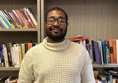 Man smiling in library