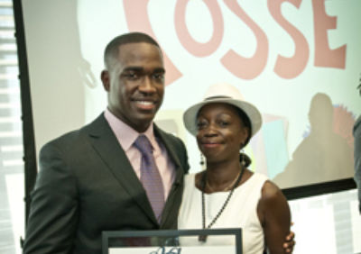 Captain Carmen Green Jr. (Trinity Posse 1, New York) accepts the 2012 Ainslie Alumni Achievement Award with his mother.