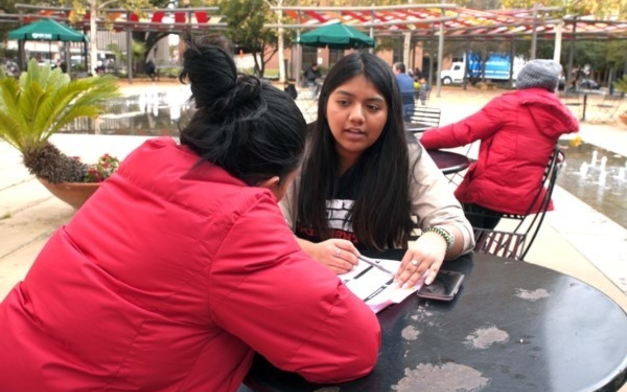 Middlebury College Posse Scholar Alondra Carmona with an asylum seeker in San Antonio, Texas.