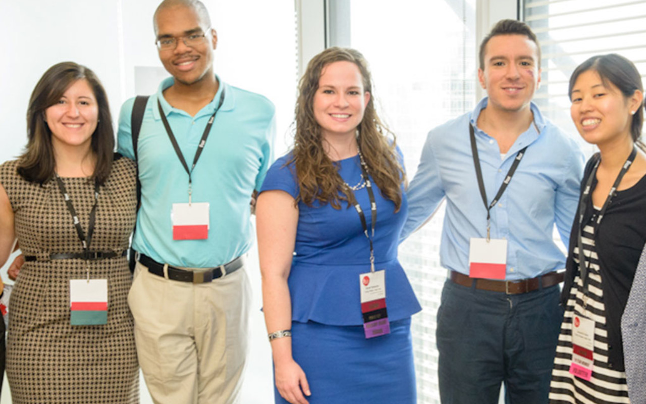 Trinity College Posse alumna Nicole Tsesmelis (center) with fellow alumni at the annual Posse leadership conference.