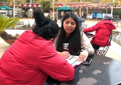 Middlebury College Posse Scholar Alondra Carmona with an asylum seeker in San Antonio, Texas. 